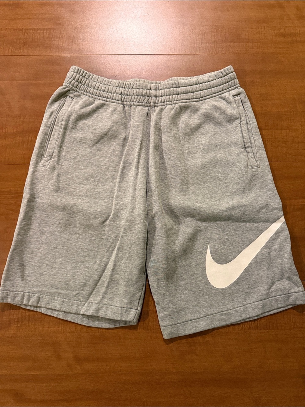 Nike Light Gray Athletic Shorts with White Swoosh